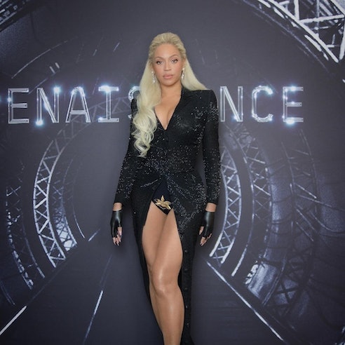 Beyonce wears a black cape and embroidered undies at the 'Renaissance' premiere.