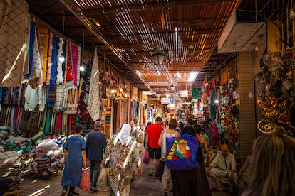 People visiting Marrakesh Souks, old market place,one of the biggest market souks in the world, Marr...