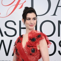 Anne Hathaway wore a red Rodarte dress that included an exposed thong moment