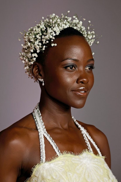 Lupita Nyong'o attended the 3rd Annual Academy Museum Gala in 2023 with a halo of baby's breath flor...
