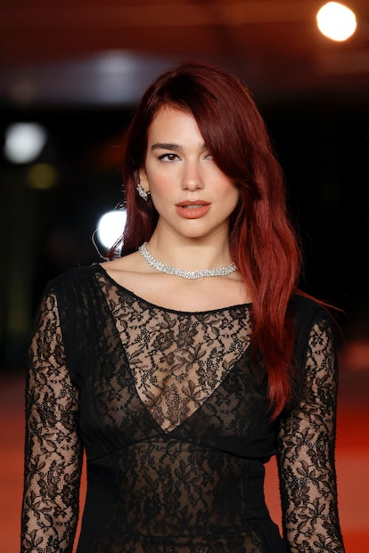 Dua Lipa attended the 3rd Annual Academy Museum Gala in 2023 with an on-trend side part in her "cher...
