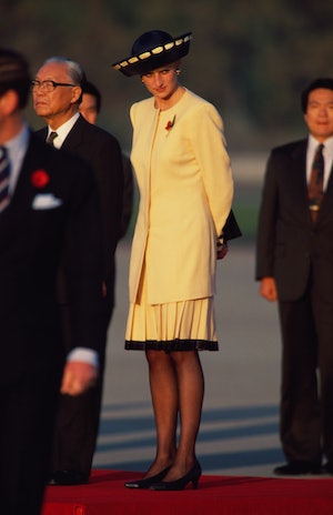 Princess Diana (1961 - 1997) wearing a Catherine Walker suit at an arrival ceremony at Seoul Air Bas...