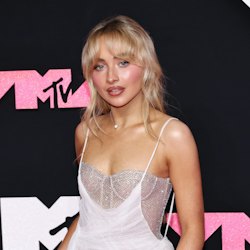 Sabrina Carpenter attends the 2023 MTV Video Music Awards in a rhinestone bustier dress
